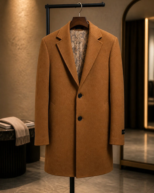 Camel wool-blend overcoat displayed on a hanger in a boutique, front view