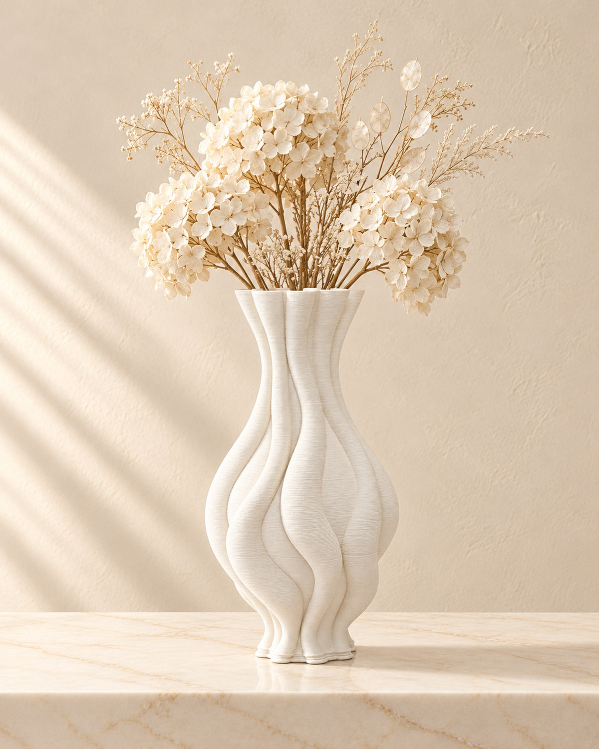 Emilie white twisted vase styled with cream dried flowers on cream marble; flowers not included